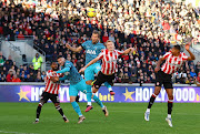 Tottenham Hotspur's Harry Kane scores their first goal in the Premier League match against Brentford at Brentford Community Stadium in London on December 26 2022.