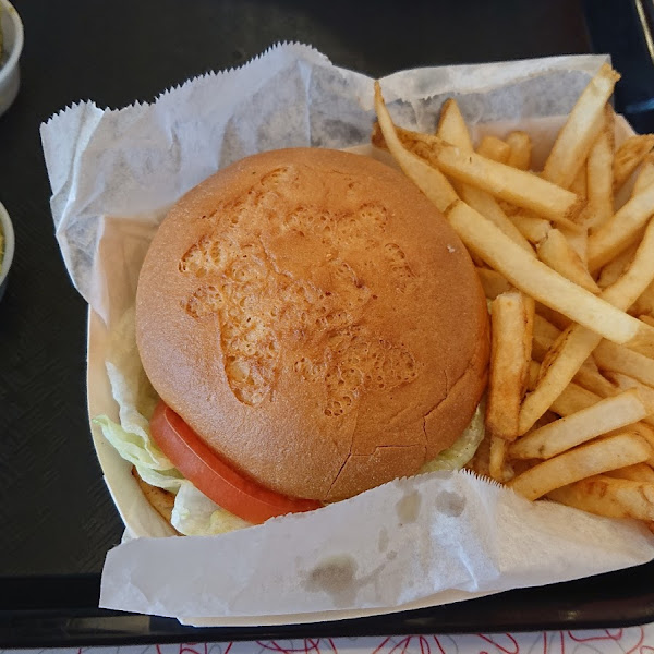 Chicken sandwich with avocado on the side