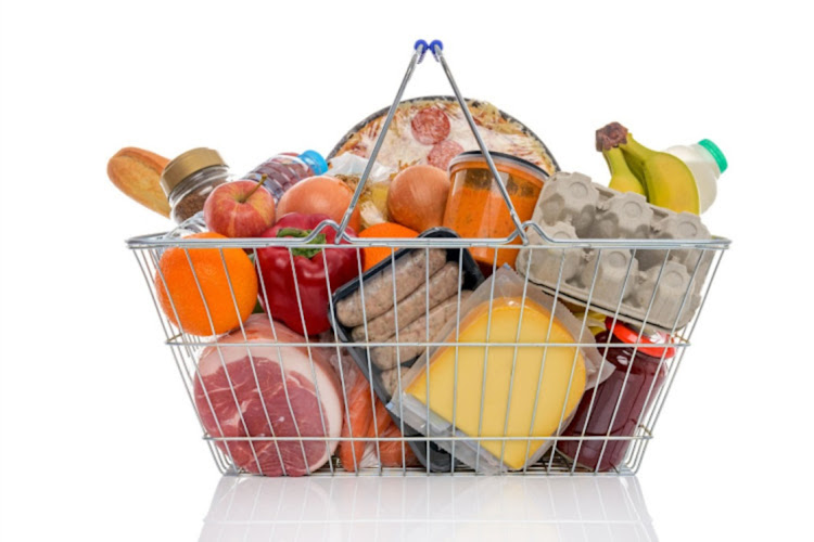 27776593 - studio shot of a shopping basket full of food including fresh fruit, vegetables, meat, pizza and dairy products. isolated on a white background.