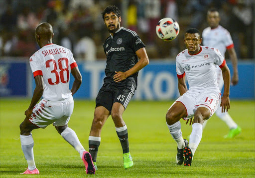 Abbubaker Mobara of Orlando Pirates marked by Peter Shalulile of Highlands Park and Mothobi mvala of Highlands Park during the Absa Premiership match between Highlands Park and Orlando Pirates at Makhulong Stadium on April 15, 2017 in Johannesburg.