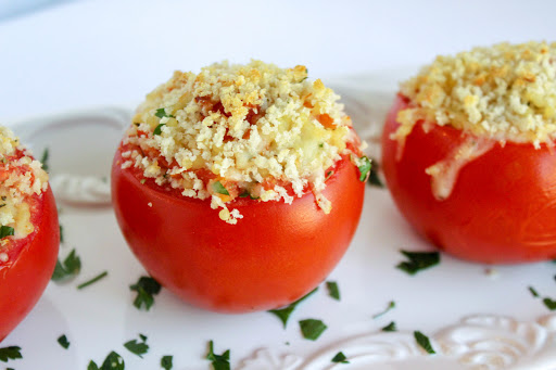 Pastina stuffed tomatoes sprinkled with fresh parsley.