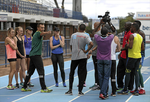 Veteran sprinter LJ van Zyl gives tips to the 4x400m women’s squad at a training camp in Pretoria on Friday.