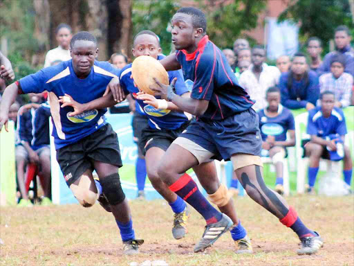 Menengai High’s Edward Njuguna (L) and Boniventure Wasonga (C) charge against Upper Hillin a past match /FILE