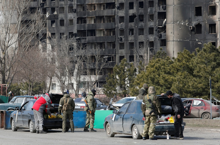 Service members of pro-Russian troops check cars during Ukraine-Russia conflict in the besieged southern port city of Mariupol, Ukraine, March 20 2022. Picture: ALEXANDER ERMOCHENKO/REUTERS