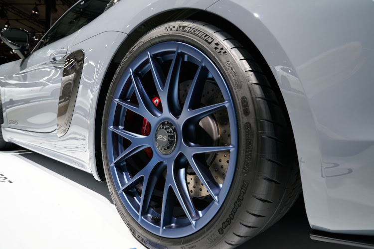 Michelin tires on a Porsche 718 Cayman GT4 4RS on display at AutoMobility LA ahead of the Los Angeles Auto Show in Los Angeles, California, U.S.