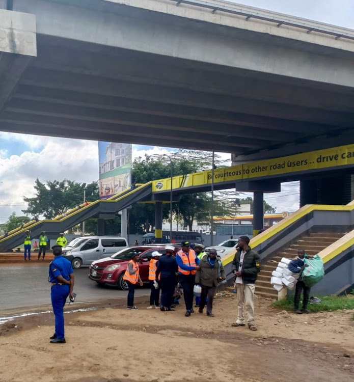 NTSA officers engaging several pedestrians