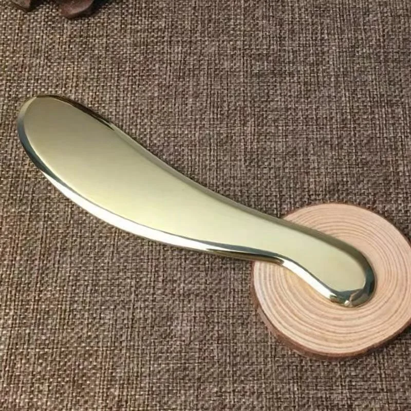 Plaque de massage musculaire et de raclage des méridiens en laiton pur. Soulage les tensions, favorise la circulation et le bien-être.