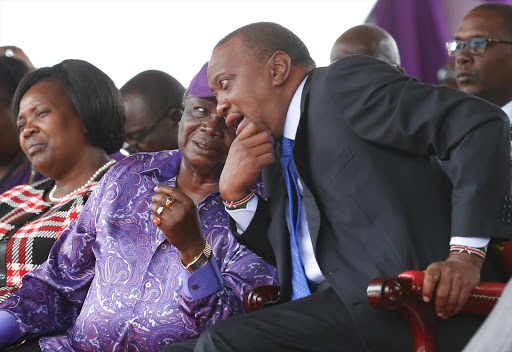 Cotu secretary general Francis Atwoli speaks with President Uhuru Kenyatta during Labour Day celebrations at Uhuru Park, May 1, 2017. /JACK OWUOR