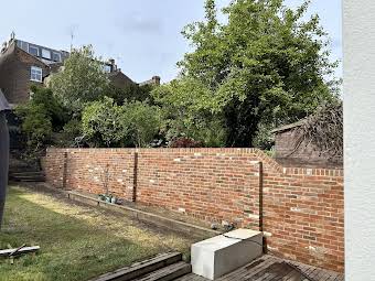 Garden wall rebuild old red stocks in Hampstead Heath album cover