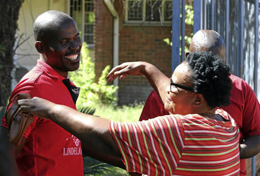 Arnold Mulaudzi, deputy chairperson of the Pro-Makhado Demarcation Task Team, is hugged by his sister Catherine Ragimana, 58, after his release yesterday. /Antonio Muchave