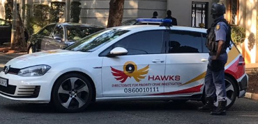 Crime accused Hawks officers promoted.