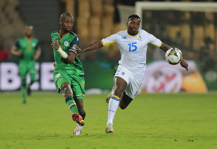 Comoros' Kassim M'Dahoma in action with Gabon's Ulrick Eneme.