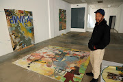 Mncedi Madolo with his art work at Asisebenze Art gallery in Johannesburg .
