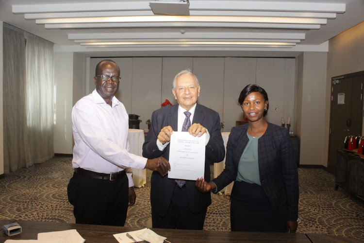 Naema Construction Director Naman Opiata, Radisson Blu Hotel and Residence, Arboretum chairman Rasik Kantaria and KFS deputy conservator Margret Wanjiru at Radisson Blu Hotel on Tuesday, December 22, 2020.