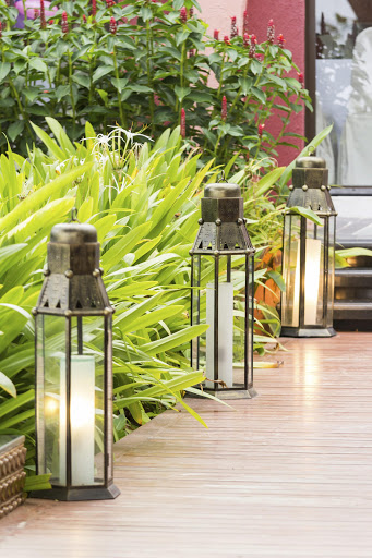 Practical meets pretty when a series of lanterns is used to illuminate a garden pathway.