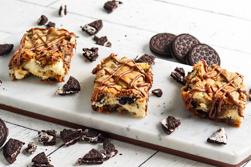 Oreo Cookie Cheesecake Blondies on a platter.