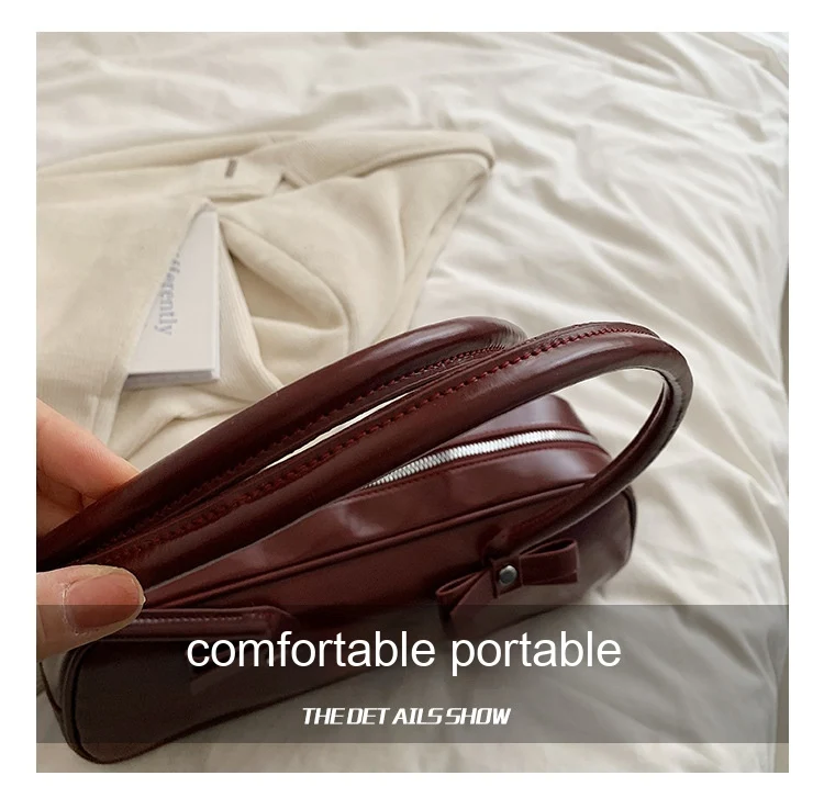 Sac bandoulière portable sous le bras, design minoritaire tendance High Sense, alliant style et praticité pour une utilisation quotidienne.