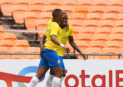 Andile Jali (left) congratulates George Maluleka on his goal in of Mamelodi Sundowns' Caf Champions League match against Al Merrikh at FNB Stadium on April 2 2022.