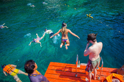 Jump from the boat deck into the inviting cool water