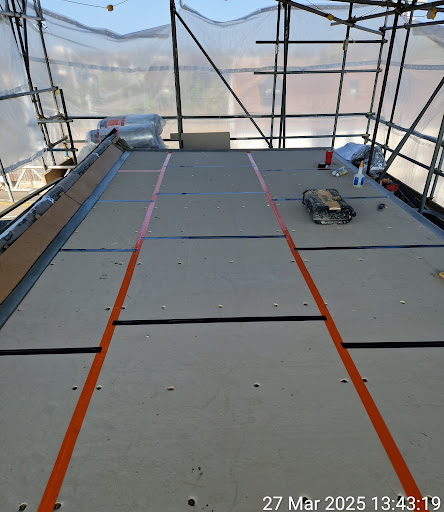 Flat roof rigid insulation in progress