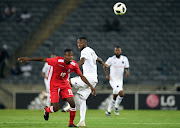 Justin Shonga of Orlando Pirates in action with Tjiuana-Tja Tjatinda of African Stars during the CAF Champions League match between Orlando Pirates and African Stars at Orlando Stadium on December 15, 2018 in Johannesburg, South Africa.