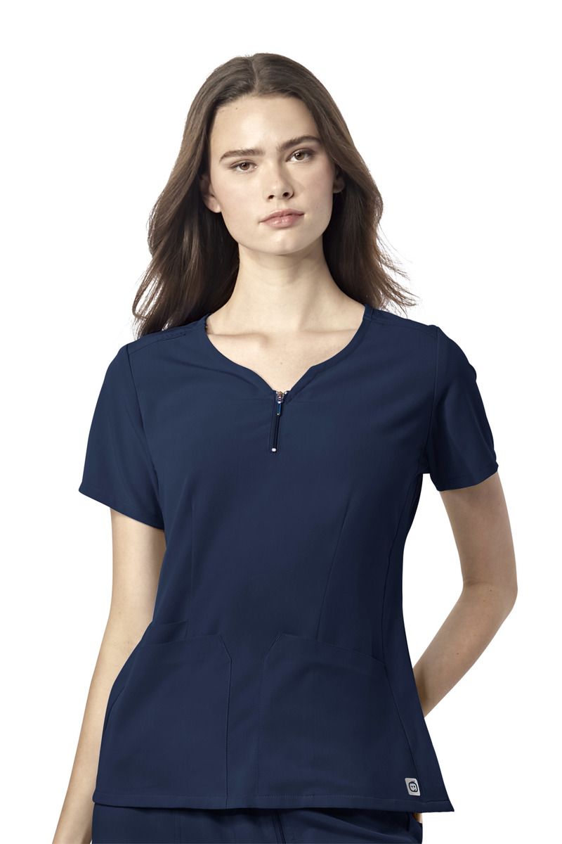 Model wearing a navy scrub top with a notch neckline