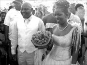 LOVEBIRDS: Lucky Nchabeleng parades his new wife Mashigo Seepe around Ga-Nchabeleng village in Sekhukhune during their wedding yesterday. 25/09/07. © Sowetan.