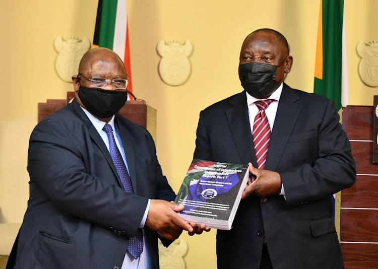 President Cyril Ramaphosa receives the first part of the state capture inquiry report from acting chief justice Raymond Zondo. File image.