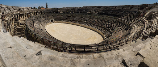 The Arena of Nîmes is a Roman amphitheater in Nîmes in the south of France. Built around AD 70, it was remodelled in 1863 to serve as a bull ring.