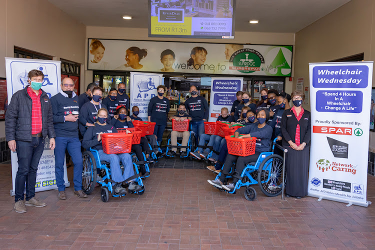 Participants in the weekly Wheelchair Wednesday initiative gather at SUPERSPAR Sunridge before spending four hours experiencing life in a wheelchair.