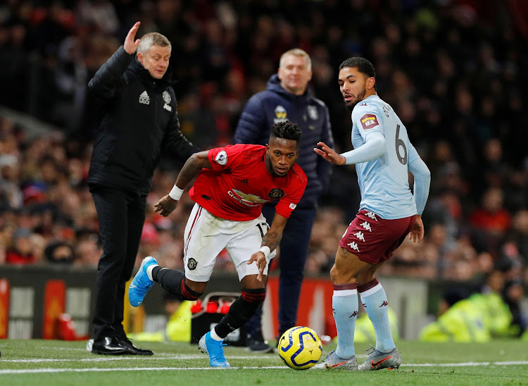 Manchester United's Fred in action with Aston Villa's Douglas Luiz