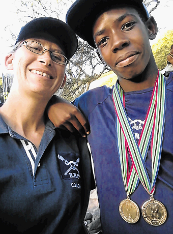 Lukho Mbongisa of Duncan Village, right, who has been selected to the SA Junior Club rowing team, with his coach, Jean Ellingson, after the 2017 SA National Rowing Championships