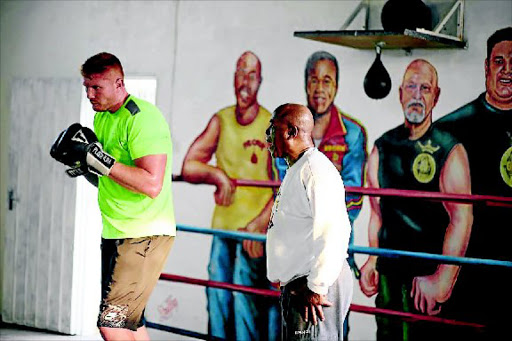 Heavyweight hopeful Ruann Visser and his new trainer, accomplished American James Ali Bashir. PHOTO: Roderick Mulugana