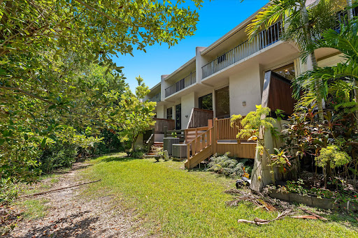 Buy this luxury house in North Miami (United States) - Modern house exterior with green garden