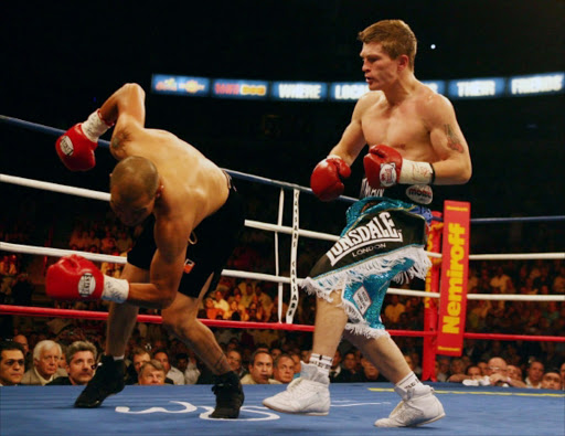 England's Ricky Hatton, right, knocks down Mexico's Jose Luis Castillo in the 1st round during their IBO junior welterweight world title fight at Thomas & Mack Center in Las Vegas on Saturday, June 23, 2007. Hatton defeated Castillo by knockout in the fourth round. (AP Photo/PA, Nick Potts) ** UNITED KINGDOM OUT, NO SALES, NO ARCHIVE **