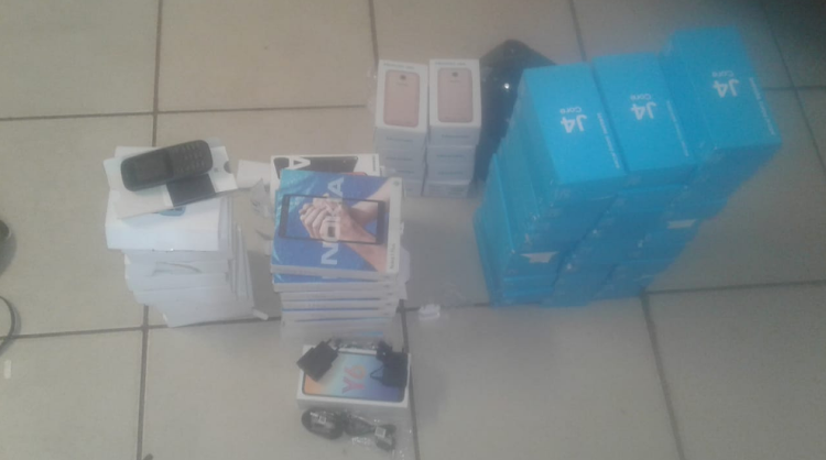 Some of the cellphones and other equipment recovered by police.