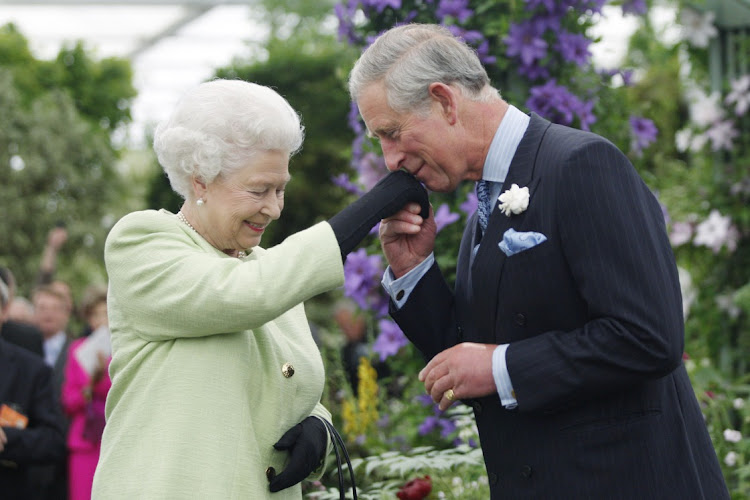 Queen Elizabeth II pictured with Prince Charles, Prince of Wales.