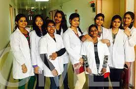 A group of women in white lab coats

Description automatically generated with medium confidence