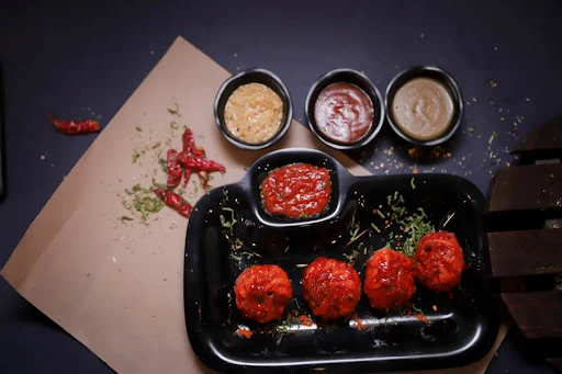 Fried Schezwan Veg Momos