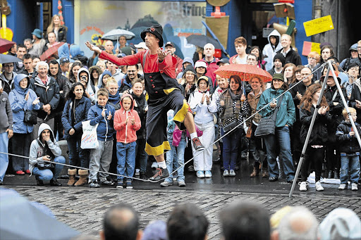 Street entertainers yesterday on the last day of the Edinburgh Festival Fringe. The festival celebrates its 66th anniversary this year Picture: JEFF J MITCHELL/GALLO IMAGES