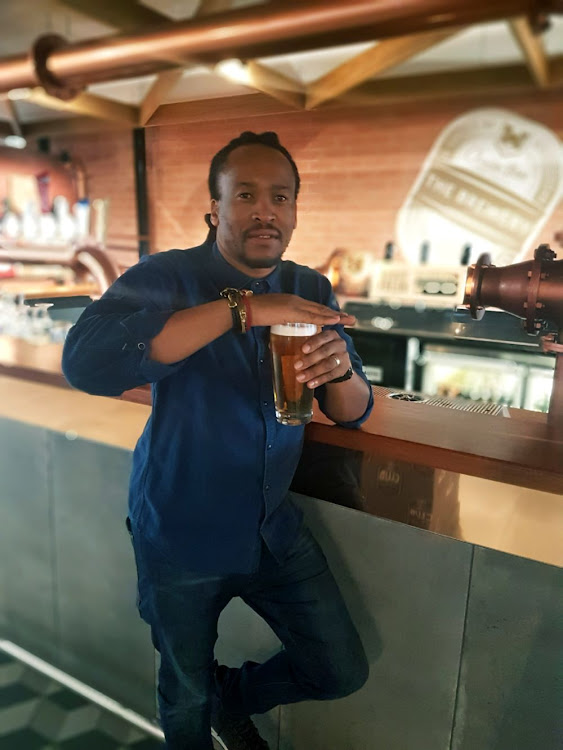 SAB and AB InBev Africa beer culture manager Tshepo Tloubatla demonstrates how to taste beer. Here he is seen swirling the beer to release the volatiles