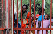 Relatives of followers of a Christian cult named as Good News International Church, who believed they would go to heaven if they starved themselves to death in Shakahola, stand outside the steel gate of the Malindi sub district hospital mortuary in Malindi, Kilifi county, Kenya April 27, 2023. 