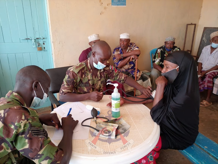 KDF medical personnel attend to patients at Kizingitini in Pate island, Lamu East.