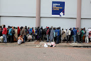 Homeless people in a queue on day 1 of the nationwide lockdown in Durban.