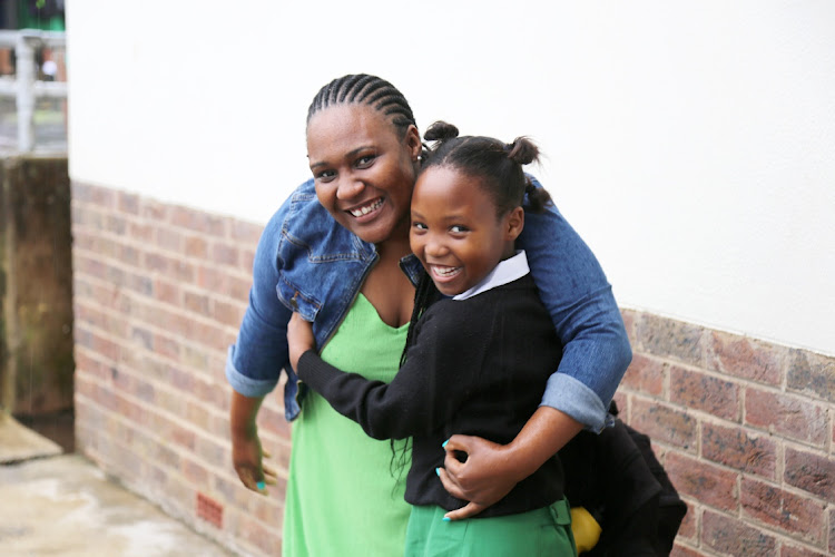 Sithenkosi Konzani gives her mom, Ayabonga, a hug before her first day of grade 3 at Cambridge Primary School East London.