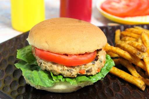 Grilled Chicken Patty on a roll with lettuce and tomato.