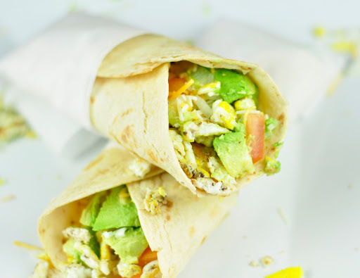 breakfast burrito with avocado and scrambled eggs