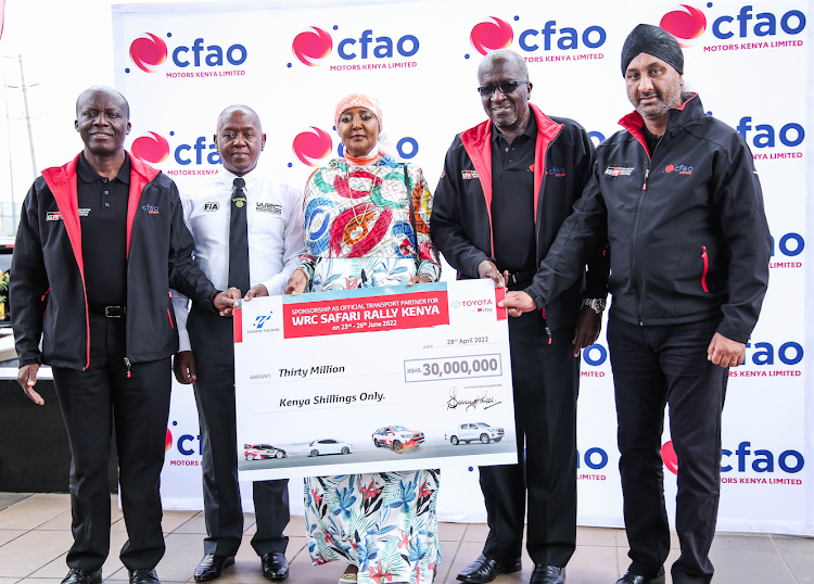 Sports CS Amina Mohamed (C) and WRC Safari Rally Kenya CEO Phineas Kimathi (2nd L) receive a Sh30m dummy cheque from CFAO Motors' Arvinder Reel (R), Dennis Awori (2nd R) and Joshua Anya.