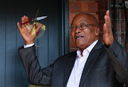 President Zuma cuts the ribbon on a housing project in Pietermaritzburg on Saturday morning.