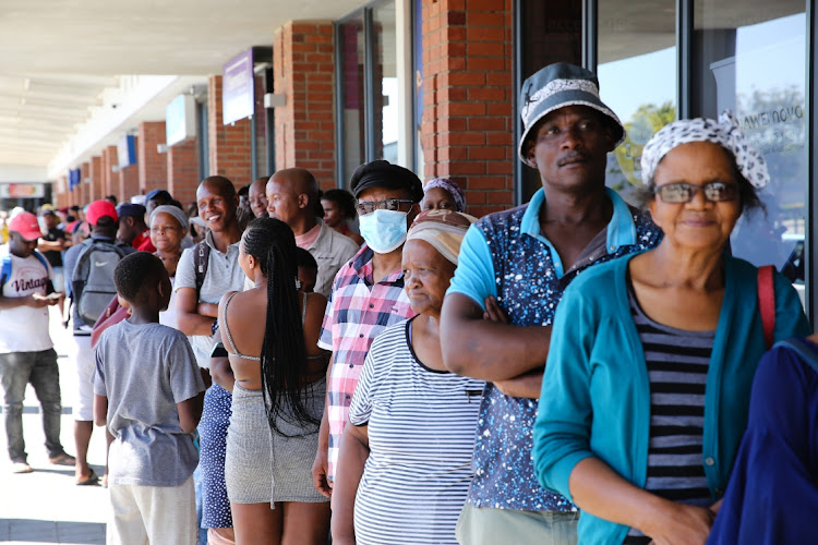 Shoppers queue outside the Kenako Mall on day one of the nationwide lockdown